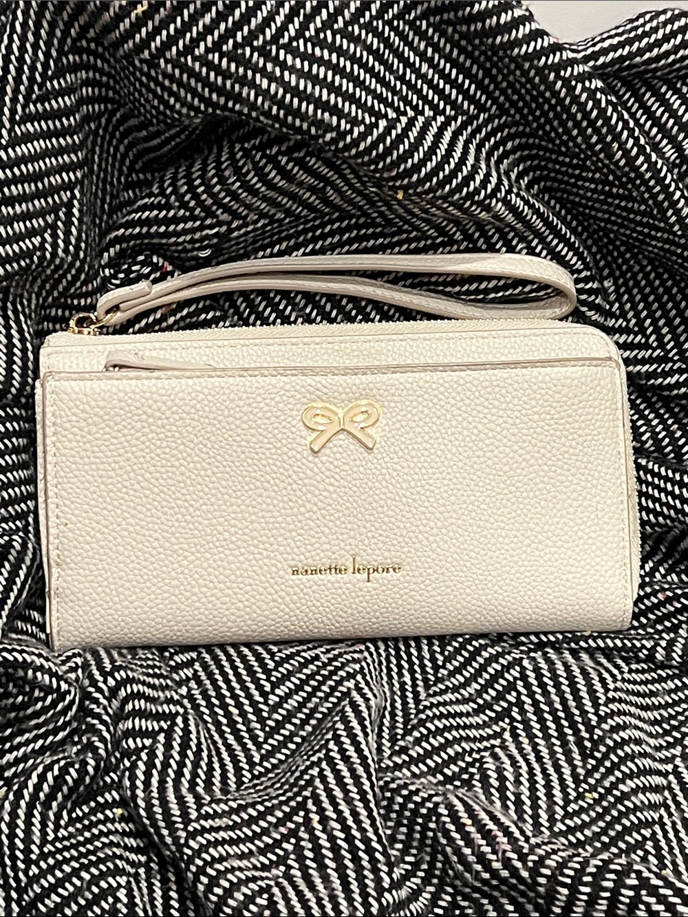 Nanette Lepore Cream Pebble Leather Wristlet with Gold Bow